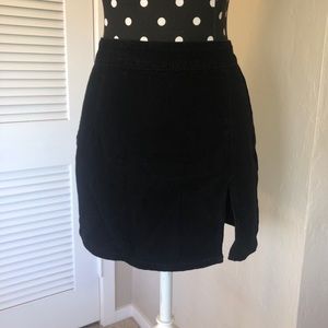 Black mini skirt with slit